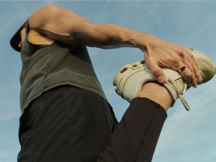 A man using his Oura ring to track his fitness