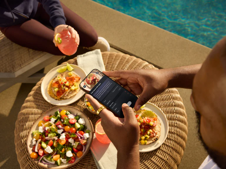 Man wearing Oura Ring taking a picture of food