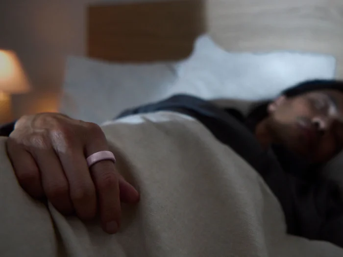Man sleeping wearing Oura Ring 4